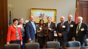 AWPA Members present an award to Senator Roy Blunt for his efforts in passing the ENFORCE Act.